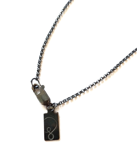 black silver clasp with symbology logo by Alice Scott