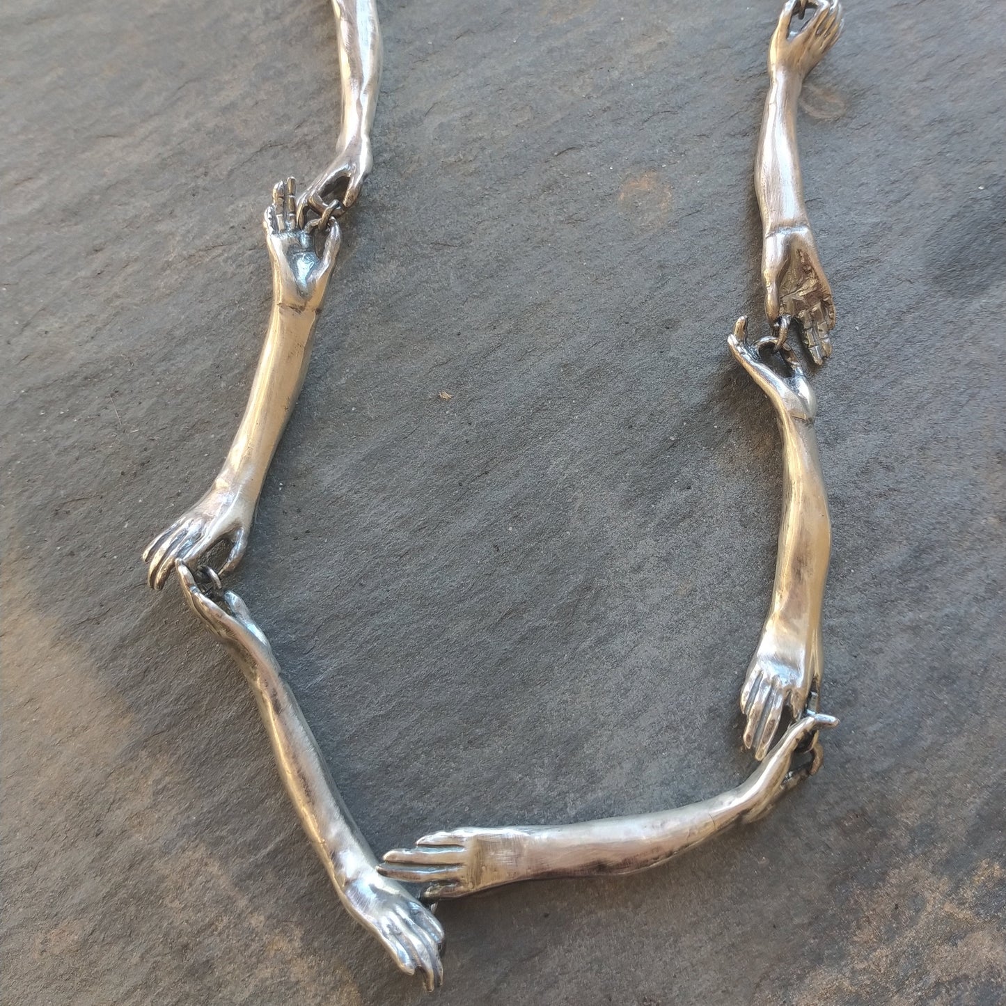 Long Silver Connecting Hands Necklace