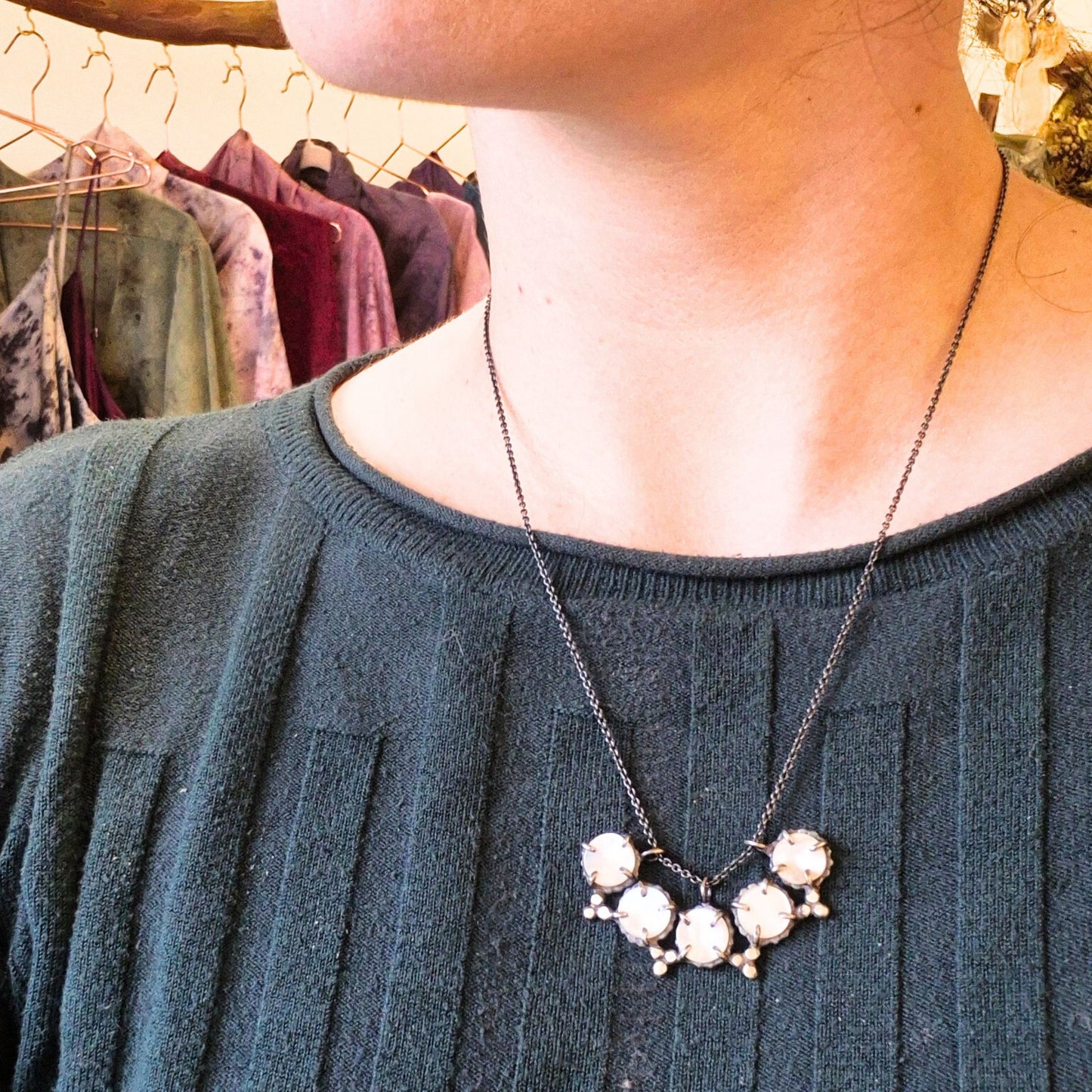 mother of pearl and silver handmade necklace by Alice Scott on model background