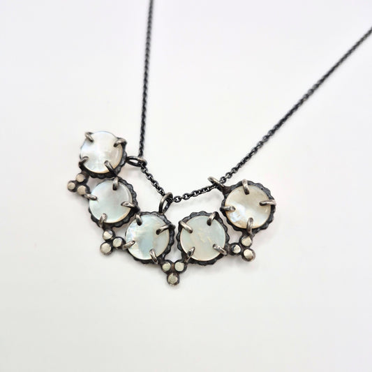 mother of pearl and silver handmade necklace by Alice Scott on white background
